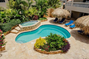 Fabulous modern 2-bedroom apartment with tropical garden, pool and jacuzzi